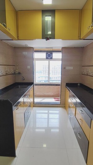 Kitchen in 3 BHK Apartment at Harsh Residency, Mira Road – for Rent