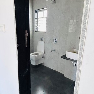 Bathroom in 3 BHK Apartment at Mohan Nagar Co Op Society – for Sale