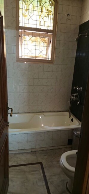 Bathroom in 2 BHK Builder Floor at Nehru Enclave – for Rent