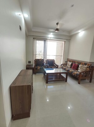 Living Room in 1 BHK Apartment at Agarwal Trinity Towers, Malad West – for Rent