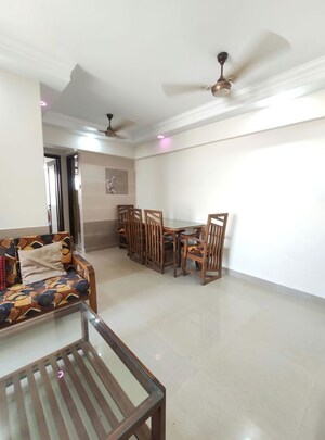Living Room in 1 BHK Apartment at Agarwal Trinity Towers, Malad West – for Rent