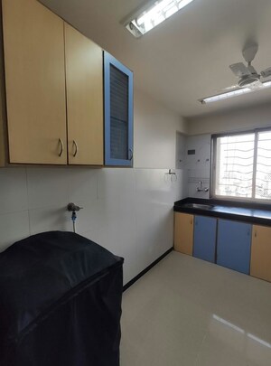Living Room in 1 BHK Apartment at Agarwal Trinity Towers, Malad West – for Rent