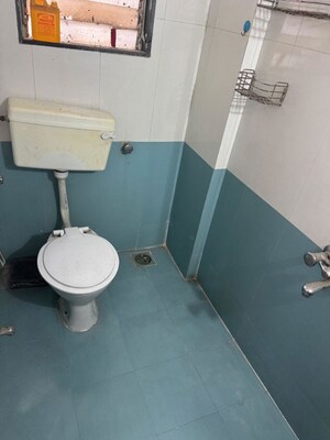 Bathroom in 1 BHK Apartment at Unnati Woods CHS, Kasarvadavali – for Rent
