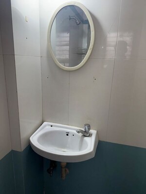 Bathroom in 1 BHK Apartment at Unnati Woods CHS, Kasarvadavali – for Rent