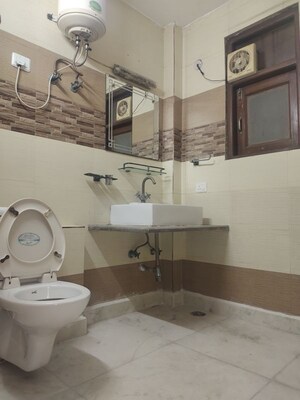 Bathroom in 3 BHK Builder Floor at Kalkaji – for Rent