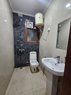 Bathroom in 2 BHK Builder Floor at Chattarpur – for Rent