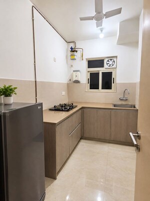 Kitchen in 2 BHK Apartment at Unnati Woods CHS, Kasarvadavali – for Rent