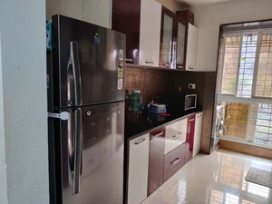 Kitchen in 2 BHK Apartment at Tharwani Rosewood Heights, Kharghar Sector 10 – for Rent