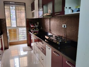 Kitchen in 2 BHK Apartment at Tharwani Rosewood Heights, Kharghar Sector 10 – for Rent