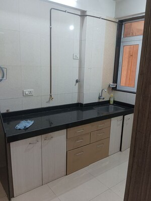 Kitchen in 2 BHK Apartment at Gemstar Symphony, Kandivali West – for Sale
