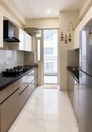 Kitchen in 3 BHK Apartment at Motia Blue Ridge, Dhakoli – for Sale