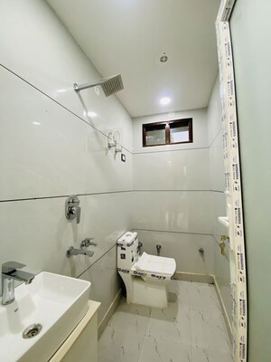 Bathroom in 3 BHK Builder Floor at Dwarka Mor – for Rent