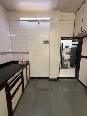 Kitchen in 1 BHK Apartment at Vidhyut CHS, Dombivli West – for Sale
