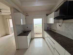 Kitchen in 3.5 BHK Apartment at Sunworld Arista, Sector 168 – for Rent