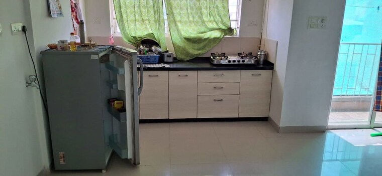 Kitchen, amanora-desire-tower 1 Bedroom 560 Sq.Ft. Apartment In Magarpatta Road Pune 10700958