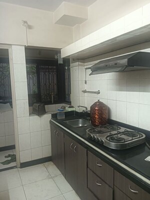 Kitchen in 2 BHK Apartment at Mahavir Apartment Malad, Malad East – for Rent