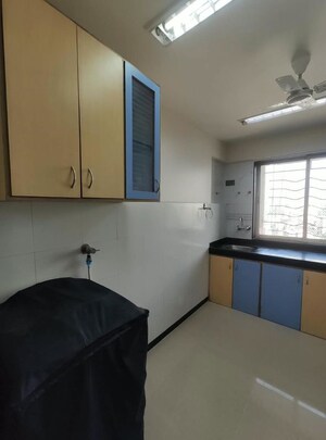 Living Room in 1 BHK Apartment at Agarwal Trinity Towers, Malad West – for Rent