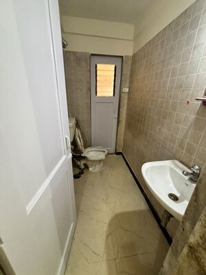 Bathroom in 2 BHK Apartment at Vijay Vatika, Kavesar – for Sale