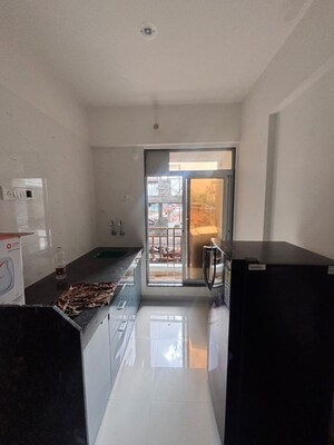Kitchen in 1 BHK Apartment at Gurukrupa PG Vatika, Badlapur East – for Sale
