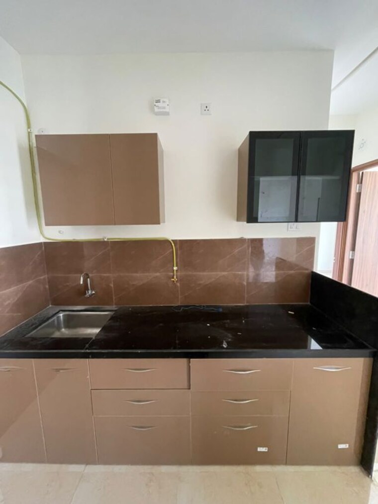 Kitchen, kolte-patil-life-republic-16th-avenue-arezo 2 Bedroom 628 Sq.Ft. Apartment In Hinjewadi Pune 10702380