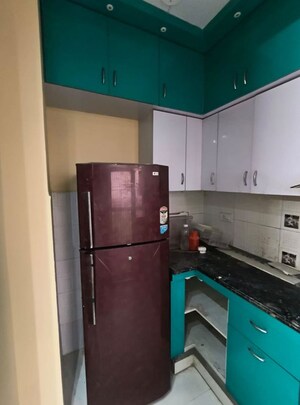Kitchen in 2 BHK Apartment at Nilaya Greens, Raj Nagar Extension – for Rent