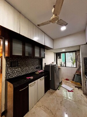 Kitchen in 2 BHK Apartment at Maharaja Retreat CHS, Goregaon East – for Rent
