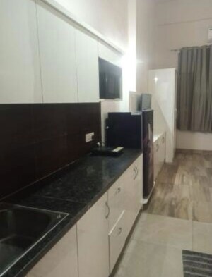 Kitchen in 1 RK Apartment at Paramount Golf Foreste Apartments, Zeta I Greater Noida – for Rent