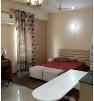 Living Room in Studio Apartment at Supertech Czar Suites, Omicron I Greater Noida – for Rent