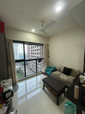 Living Room in 1 BHK Apartment at Lodha Crown Quality Homes, Majiwada – for Rent