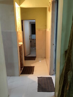 Building Lobby in 2 BHK Apartment at Devdarshan Complex, Kharghar Sector 19 – for Rent