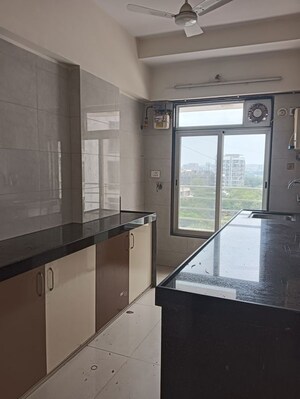Kitchen in 1 RK Apartment at GRPM Zee Heights, Vile Parle East – for Rent