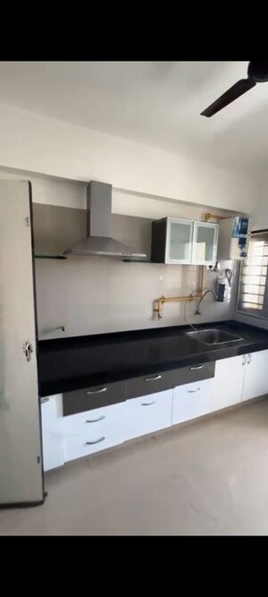 Kitchen in 2 BHK Apartment at Sthapatya Pratham Lakeview, Science City – for Rent