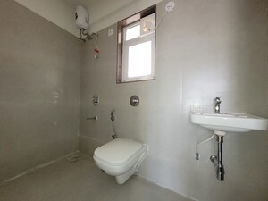 Bathroom in 2 BHK Apartment at Puranik City Reserva, Ghodbunder Road – for Rent
