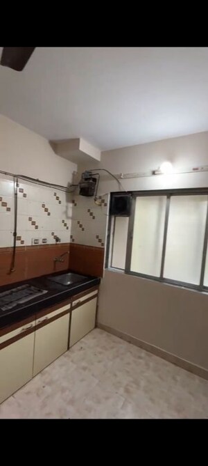 Kitchen in 2 BHK Apartment at Preetam Park Apartment, Kandivali East – for Rent