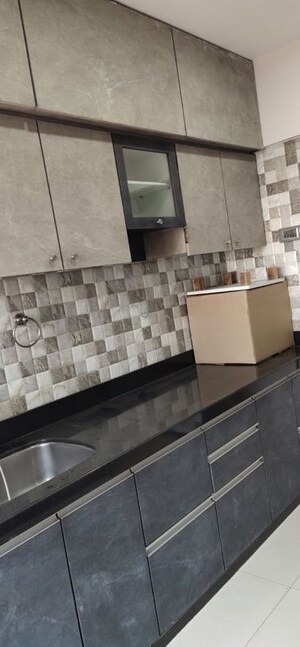 Kitchen in 2 BHK Apartment at Cosmos Orchid, Ghodbunder Road – for Rent