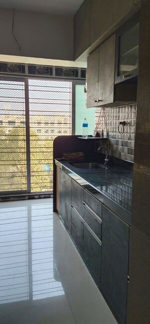 Kitchen in 2 BHK Apartment at Cosmos Orchid, Ghodbunder Road – for Rent