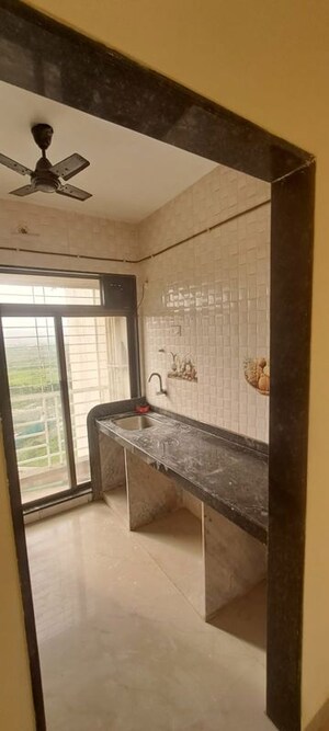 Kitchen in 1 BHK Apartment at Eden Garden II, Sector 52 Dronagiri – for Sale