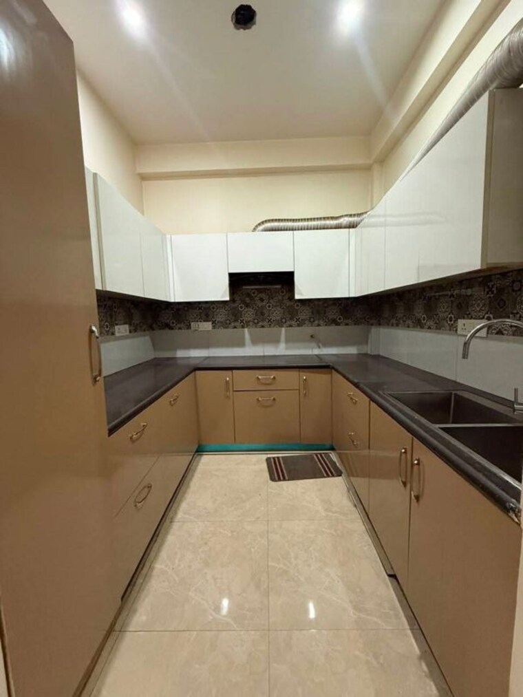 Kitchen, unitech-uniworld-gardens-2 2 Bedroom 973 Sq.Ft. Apartment In Sector 47 Gurgaon 10705886