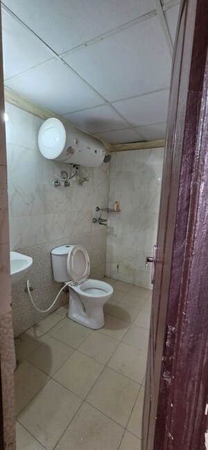 Bathroom in 2 BHK Apartment at Aims Golf City, Sector 75 – for Rent