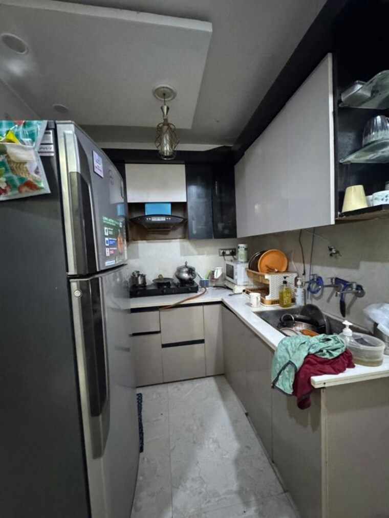 Kitchen, dwarka mor 3 Bedroom 100 Sq.Yd. Builder Floor In Dwarka Mor Delhi 10706612