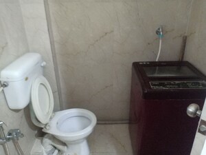 Bathroom in 4 BHK Apartment at Harsiddh Park CHS, Vasant Vihar – for Rent