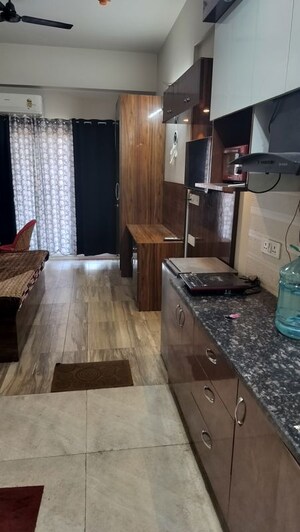 Living Room in Studio Apartment at Paramount Golfforeste, Zeta I Greater Noida – for Rent