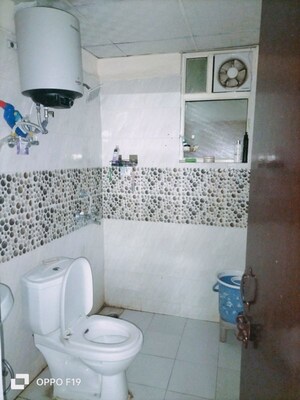 Bathroom in 2.5 BHK Apartment at Raj Nagar Extension – for Sale