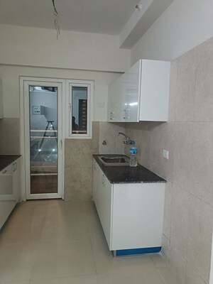 Kitchen in 2 BHK Apartment at Samridhi Luxuriya Avenue, Sector 150 – for Rent