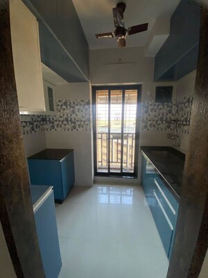 Kitchen in 1 BHK Apartment at Raunak Unnathi Woods Phase 7 A And B, Ghodbunder Road – for Rent