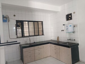 Kitchen in 2 BHK Apartment at Kanchan Ganga CHS, Aundh – for Rent