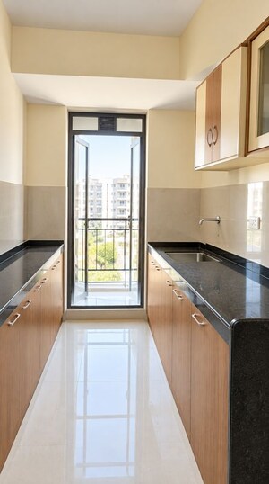 Kitchen in 2 BHK Apartment at Rustomjee Avenue L1, Virar West – for Rent