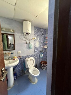 Bathroom in 3 BHK Apartment at Aims Golf City, Sector 75 – for Sale