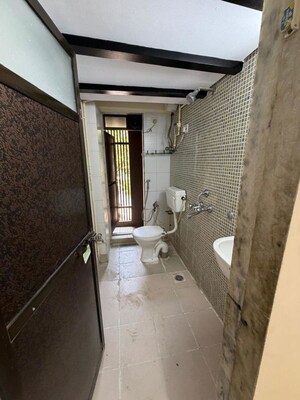 Bathroom in 2 BHK Apartment at Awadhoot CHS, Andheri West – for Rent
