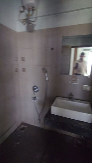 Bathroom in 1 BHK Apartment at Rustomjee Meridian, Kandivali West – for Rent